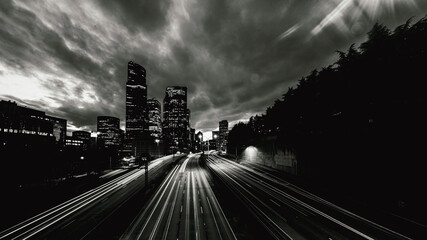 MAY 2024, SEATTLE, WASHINGTON, USA - streaked car lights off Interstate 5 leading into downtown Seattle Washington