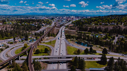 MAY 2024, SPOKEANE, WA., USA - drone aerial view of Interstate 90 leading to downtown Spokeane Washington focuses on City Center with Waterfalls and river