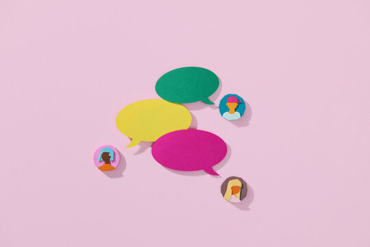 Colorful Speech Bubbles and People Icons on Pink Background - Powered by Adobe