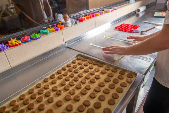Faceless Baker makes cookies in the bakery