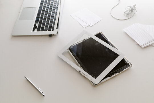 Broken tablet and laptop
