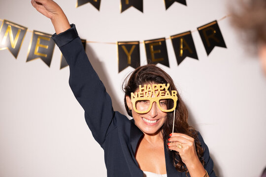 Cheerful woman enjoying new year party