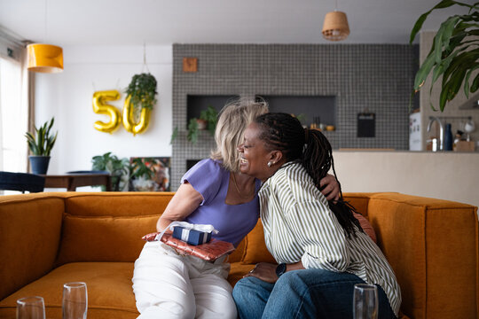 Happy women friends celebrating birthday 