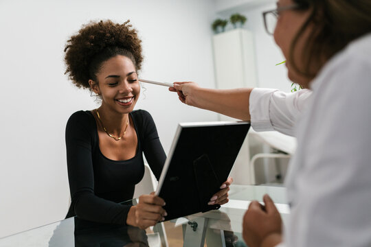 Smiling Client During Skincare Evaluation