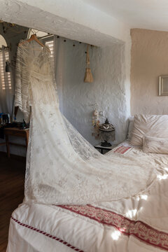 Wedding dress on bed
