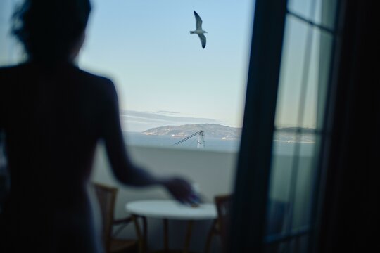 A serene moment by the window with a distant view In Gibraltar