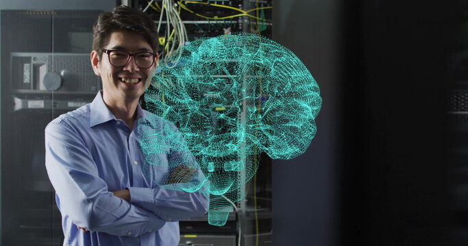 Image of glowing brain network over smiling asian male technician in dark server room