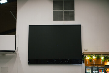 Large TV screen in airport terminal 