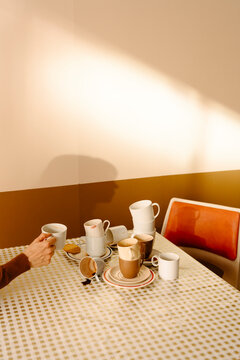 Cozy Coffee Time with Stack of Empty Mugs on Table