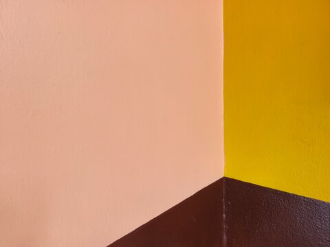 Colourful cemented wall with three different colour