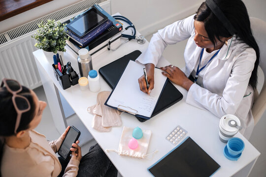 A woman at a consultation with a gynecologist in a private clinic.