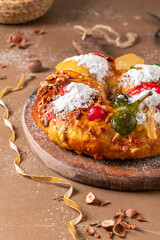 Bolo do Rei or King s Cake, Made for Christmas, Carnavale or Mardi Gras with Christmas season elements in Background.