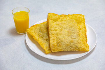 Traditional Brazilian fried pastry stuffed with ground beef. 