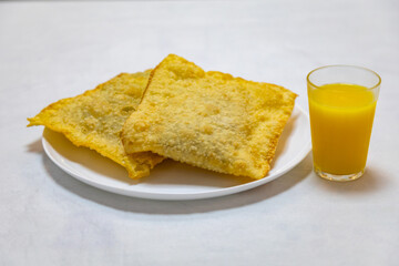 Traditional Brazilian fried pastry stuffed with ground beef. 