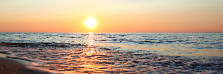 Panoramic view of waves washing ashore at sunset along beautiful Lake Superior