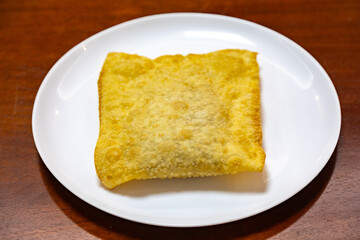 Traditional Brazilian fried pastry stuffed with ground beef. 