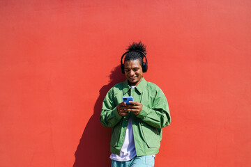 Relaxed man browsing phone outdoors