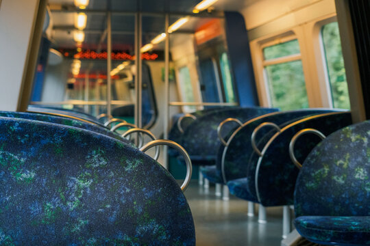 Empty metro train interior with comfy seats