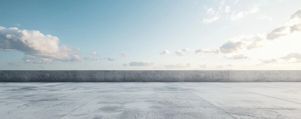 Empty concrete floor and gray wall, 3D rendering with a clear sky background.