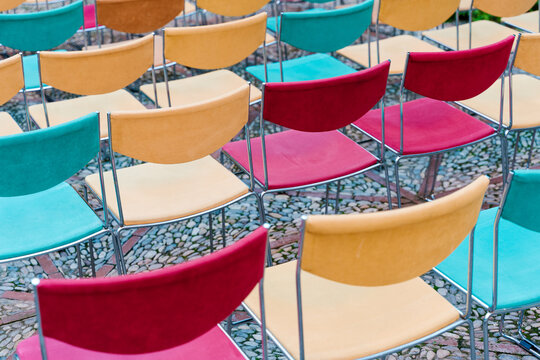 Symmetrical Rows of Colorful Chairs Outside