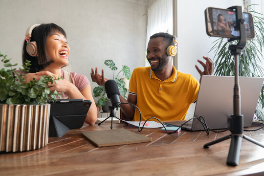 People Laughing While Recording A Podcast Indoors