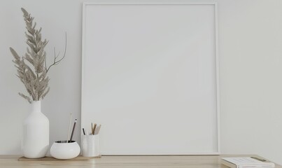 Minimalist interior design mockup with a blank white frame. vase. pencils. and a book on a wooden table