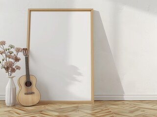 A blank frame leaning against a white wall with a vase of flowers and a guitar in front of it