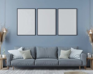 Modern living room with blue walls. grey sofa. three empty frames. and wooden floor
