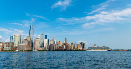 Fototapeta premium Cruise ship York. Skyline of New York Manhattan cruising on the Hudson River cruise liner. New york cruise lines ships vacation