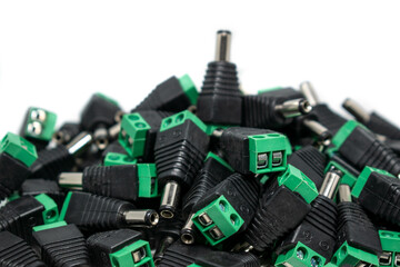 A lot of male DC power plug connectors for CCTV security cameras security concept. selective focus, copy space