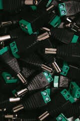 Close up DC power male plug connectors for CCTV security cameras security concept. selective focus background