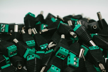 Stack of DC connectors for CCTV cameras component and installation concept, selective focus, copy space