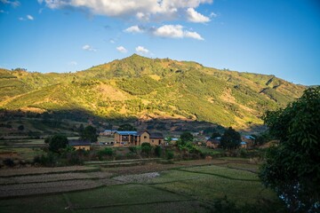 Naklejka premium Panoramic View of Farmland and Hills in Madagascar