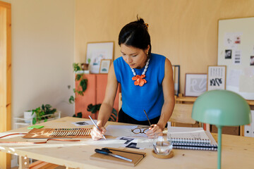Female designer working on a project in her studio