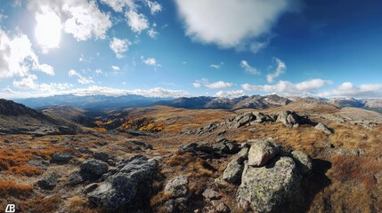 Obraz premium A sweeping panoramic shot of the Continental Divide in Colorado during autumn, showcasing vibrant fall colors and dramatic mountain scenery.