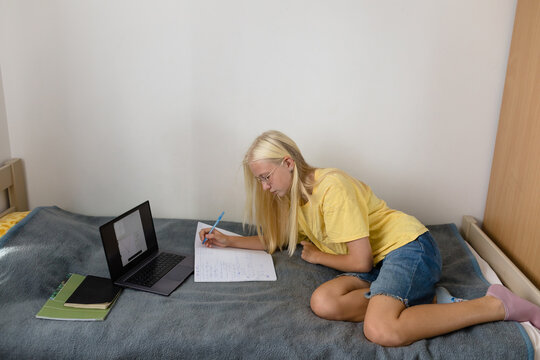 Student doing homework in the room