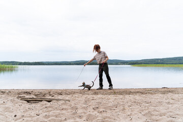 Woman walks cat nature