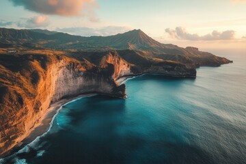 Sunset over dramatic coastal cliffs and ocean.