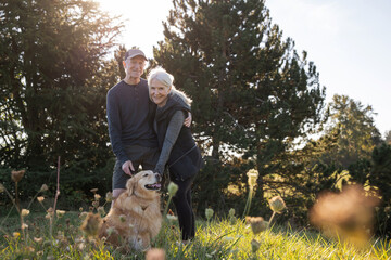 Senior Couple Enjoying a Day Outdoors with Their Dog