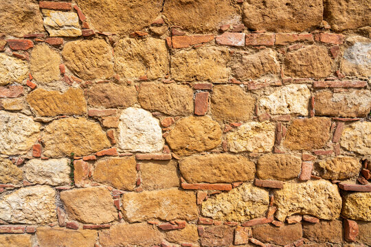 Stone wall in the village of Pienza, Tuscany, Italy