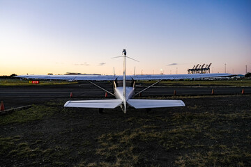 Small aircraft at airport hangar