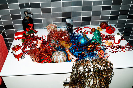 pile of christmas ornaments in the sink