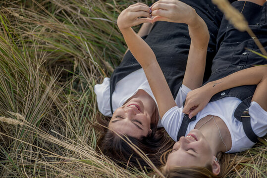 Young mother and daughter teenager in nature