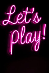 Let's Play! Bright Neon Sign on a Dark Background