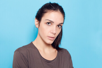 Beautiful smiling woman on blue background.