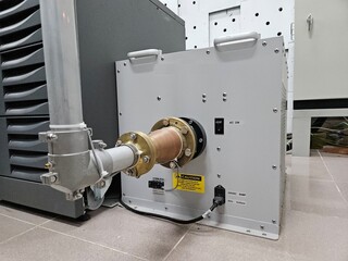 Waveguide with an elbow joint secured by bolts and stainless steel hose clamps. Television...