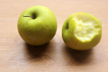 green apples on wooden table