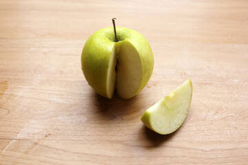 green apple on wooden table