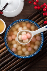 Red and white tangyuan with syrup soup.