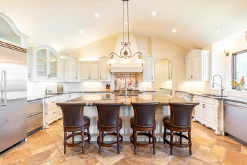 Modern kitchen design with spacious island and elegant seating area